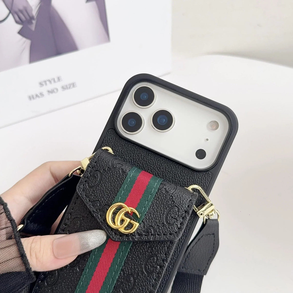 Rear view of black wallet phone case with red and green stripe
